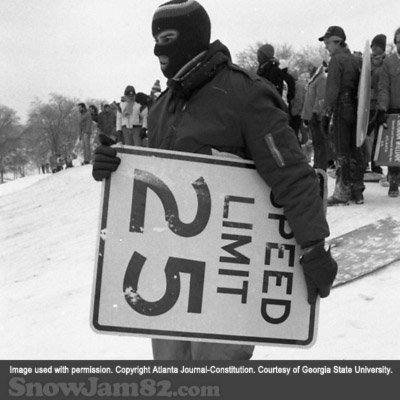 Unidentified person with a makeshift sled in Piedmont Park during a snow storm - January 14, 1982 – Rich Mahan
