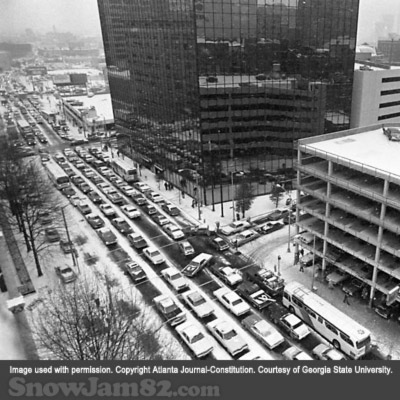 Workers and vehicles attempt to leave a congested downtown Atlanta as a snow storm approaches the area - January 13, 1982 – Nick Arroyo