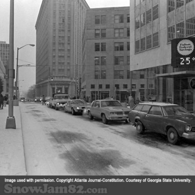 Workers and vehicles attempt to leave a congested downtown Atlanta as a snow storm approaches the area - January 13, 1982 – Dwight Ross Jr.