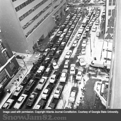 Workers and vehicles attempt to leave a congested downtown Atlanta as a snow storm approaches the area - January 13, 1982 – Nick Arroyo