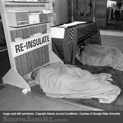 Unidentified people sleeping while taking shelter at the disaster relief headquarters during a snow storm - January 13, 1982 – Dwight Ross Jr.